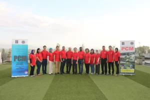 Team building event participants in red shirts