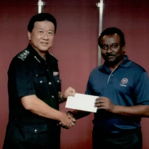 officer presenting certificate to participant