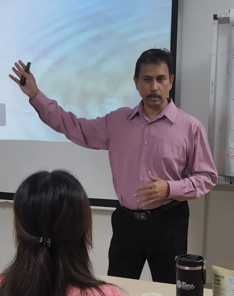 Trainer conducting a professional workshop presentation