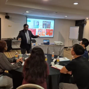 Trainer leading group workshop discussion session