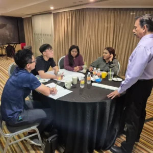 Facilitator leading a team discussion during a corporate workshop