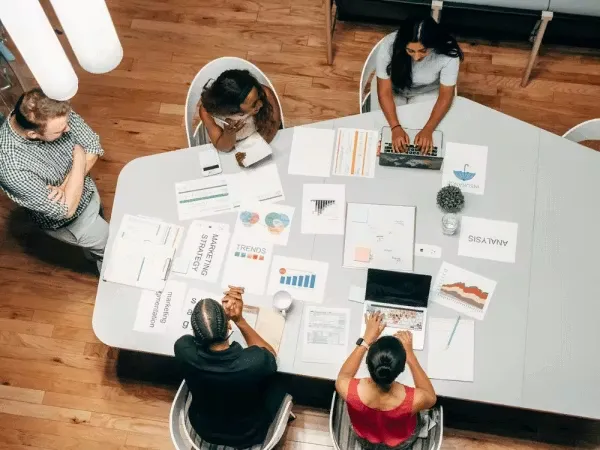 Team collaborating on a business project meeting